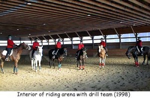A mounted drill team in the indoor arena